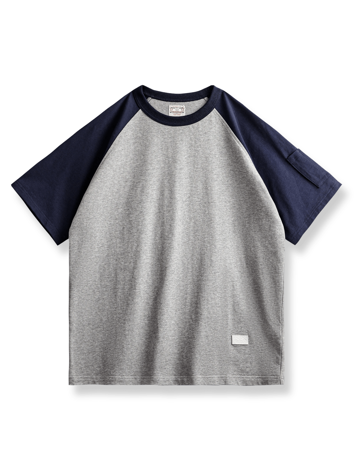 MA‑1風ペンポケット付きのヴィンテージラグランスリーブベースボールシャツ。