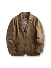 重工ウォッシュ加工のコットンブレザー、立体裁断のラペルとポケットステッチが特徴の全体像。