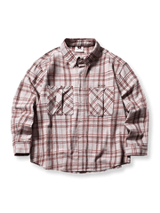 アーチ状の裾とヴィンテージチェック柄、ダブルポケットを備えた100%コットンシャツ。ネルシャツ風のリラックスシルエットが特徴。