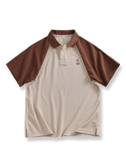 バイカラーのラグランスリーブと刺繍が特徴の高密度ニットポロシャツ