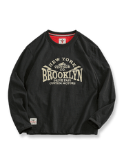 BROOKLYNロゴのヴィンテージプリントと裾パッチが特徴の長袖Tシャツ