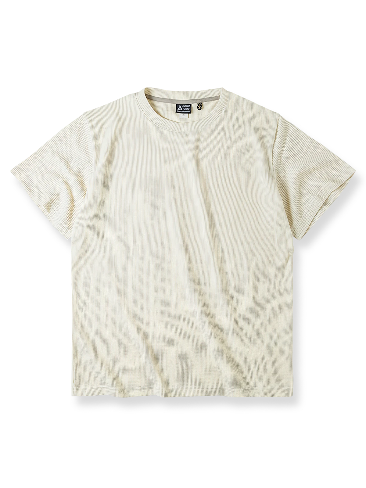 格子状のワッフル織りとベージュカラーが特徴のクラシックワッフルニットTシャツの画像。