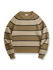 ツートンストライプとパイナップル編みが特徴のヴィンテージ風セーター。
