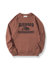 エルムウッド小学校のバッジとマスコットが胸にプリントされたラグランスリーブスウェットの画像