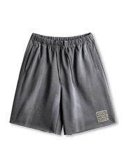 370g/m²のヘビーウェイトスウェット生地をウォッシュし、青波紋刺繍がアクセントのヴィンテージ風ワイドショーツ