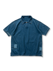 インディゴ染めと刺繍パッチが特徴のヴィンテージ風ポロシャツ