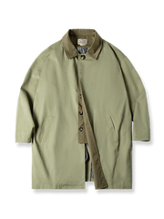 ゆったりシルエットと隠しボタンが特徴の中長丈バルマカーンコート。