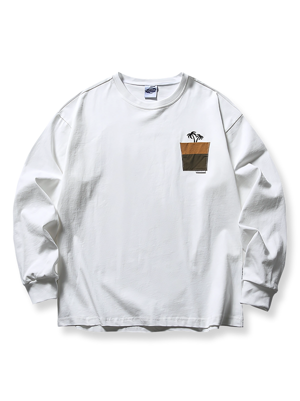 胸元にヤシの木刺繍が施された280gコットンの長袖Tシャツ。柔らかく通気性に優れたルーズフィットシルエット。