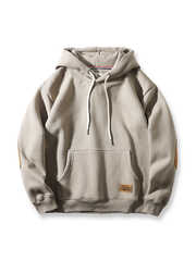 ヘビーフリースとスエード調パッチを用いたヴィンテージ感あるルーズフィットパーカー