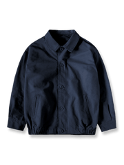 製品画像: コットンパールキャンバス製のトレーニングジャケット
詳細画像: 襟とヴィンテージ加工メタルジッパーのディテール