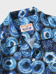 PLAME AUBEアロハシャツの細部、前面ポケットと独特な円模様のクローズアップ