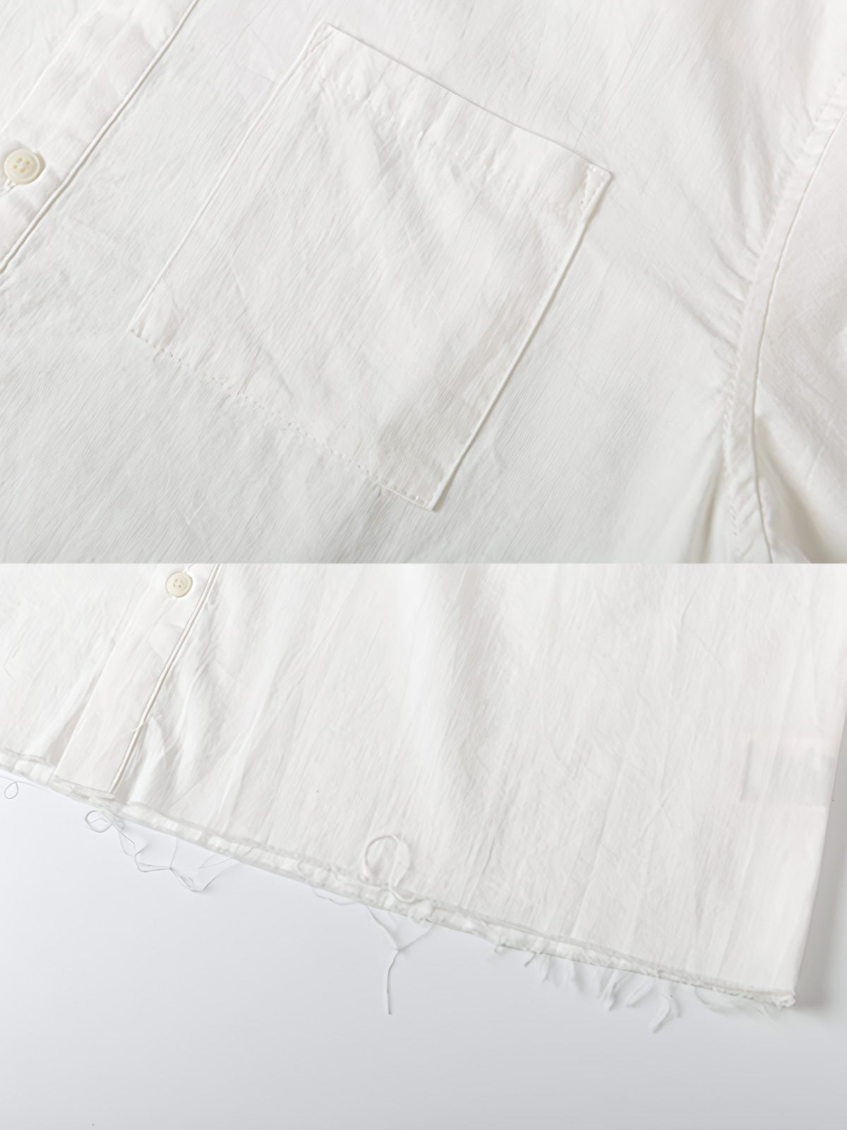 シャツのディストレストリムデザインとウォッシュドディテールのクローズアップ