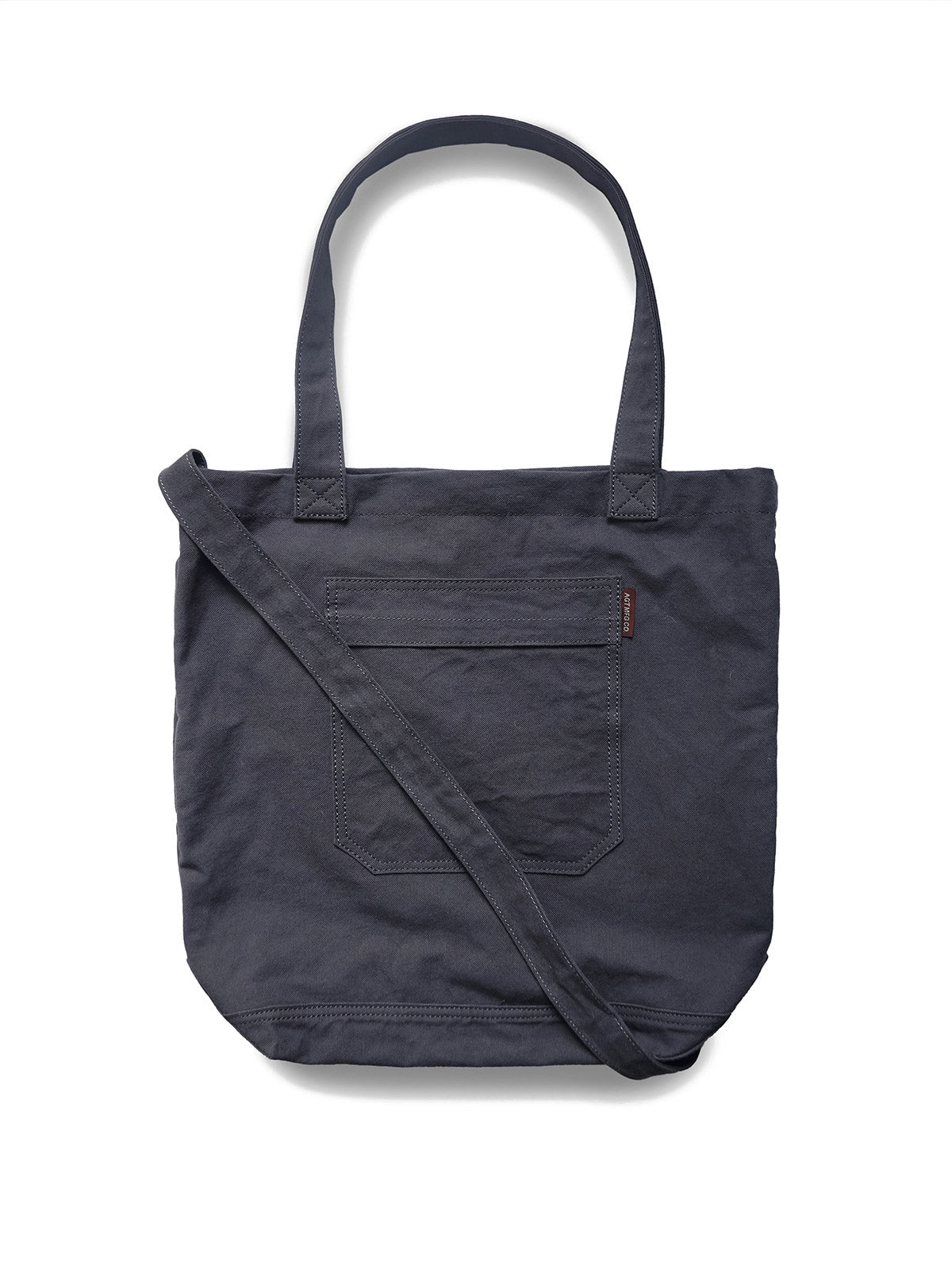 製品画像: ウォッシュ加工キャンバス通勤バッグの正面画像。PCスリーブ付きで、通勤やライディングに適したデザイン。
詳細画像: 外側のジッパーポケットとスマートフォン用ポケットのディテール画像。小物収納に便利な実用的デザイン。