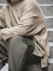 裾ボタンデザイン フード付きスウェット