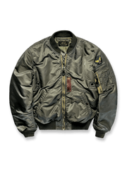 リバーシブル仕様のMA-1フライトジャケット。両面ウールライナー、防風防水シェル、IDEAL/TALONジッパーを備えたミリタリーデザイン。