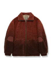 グラデーションカラーのパッチワークとシェルパフリースライナーを備えた立襟ジャケット。