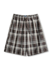 歴史あるタータンチェック柄とドローストリングウエストが特徴の膝上丈ワイドショーツ