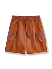 立体的なダブルポケットと鮮やかなオレンジが特徴のナイロンビーチパンツ。