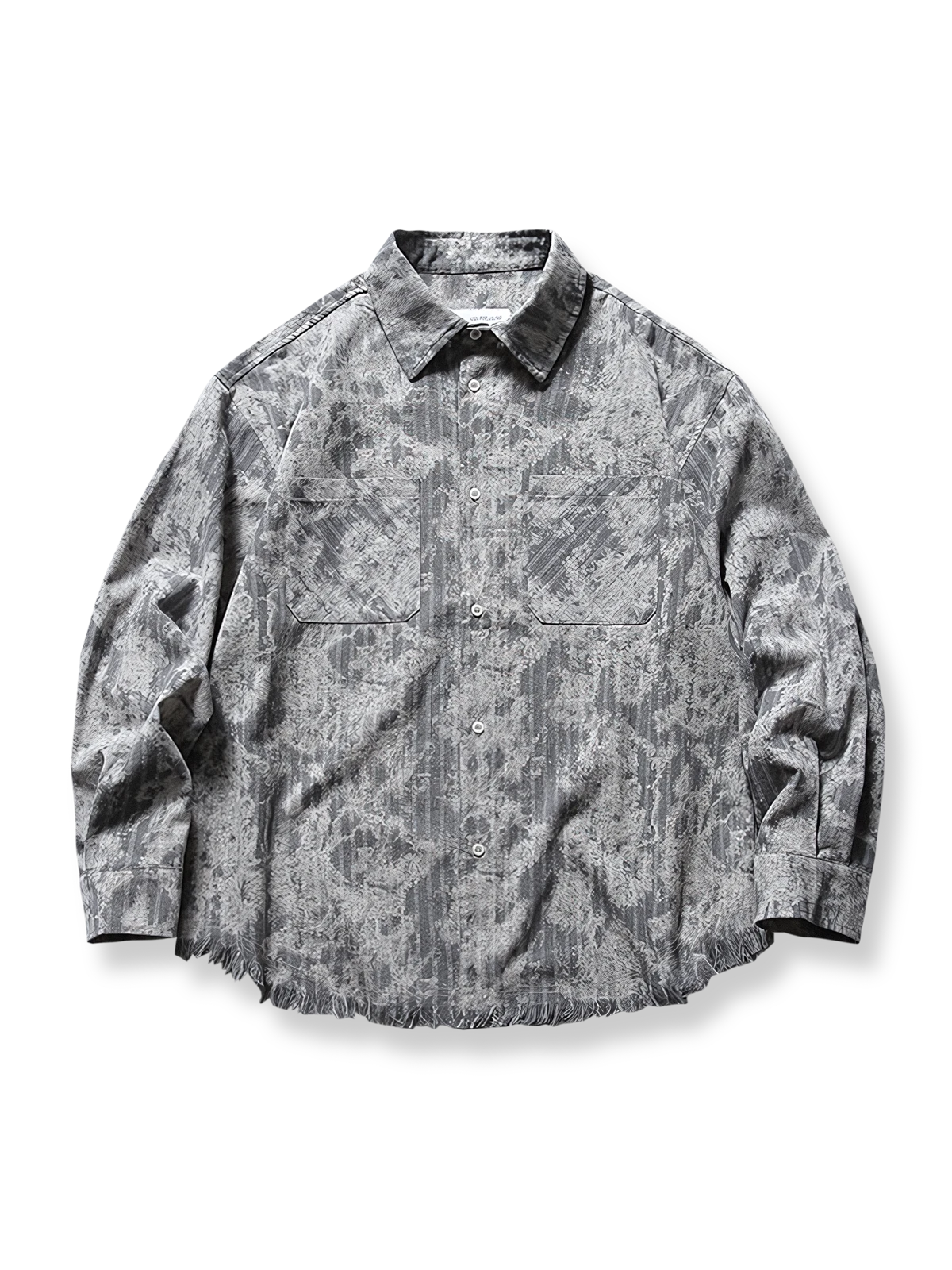 タイダイチェック柄とフリンジ裾が特徴的なリラックスフィットの長袖シャツ