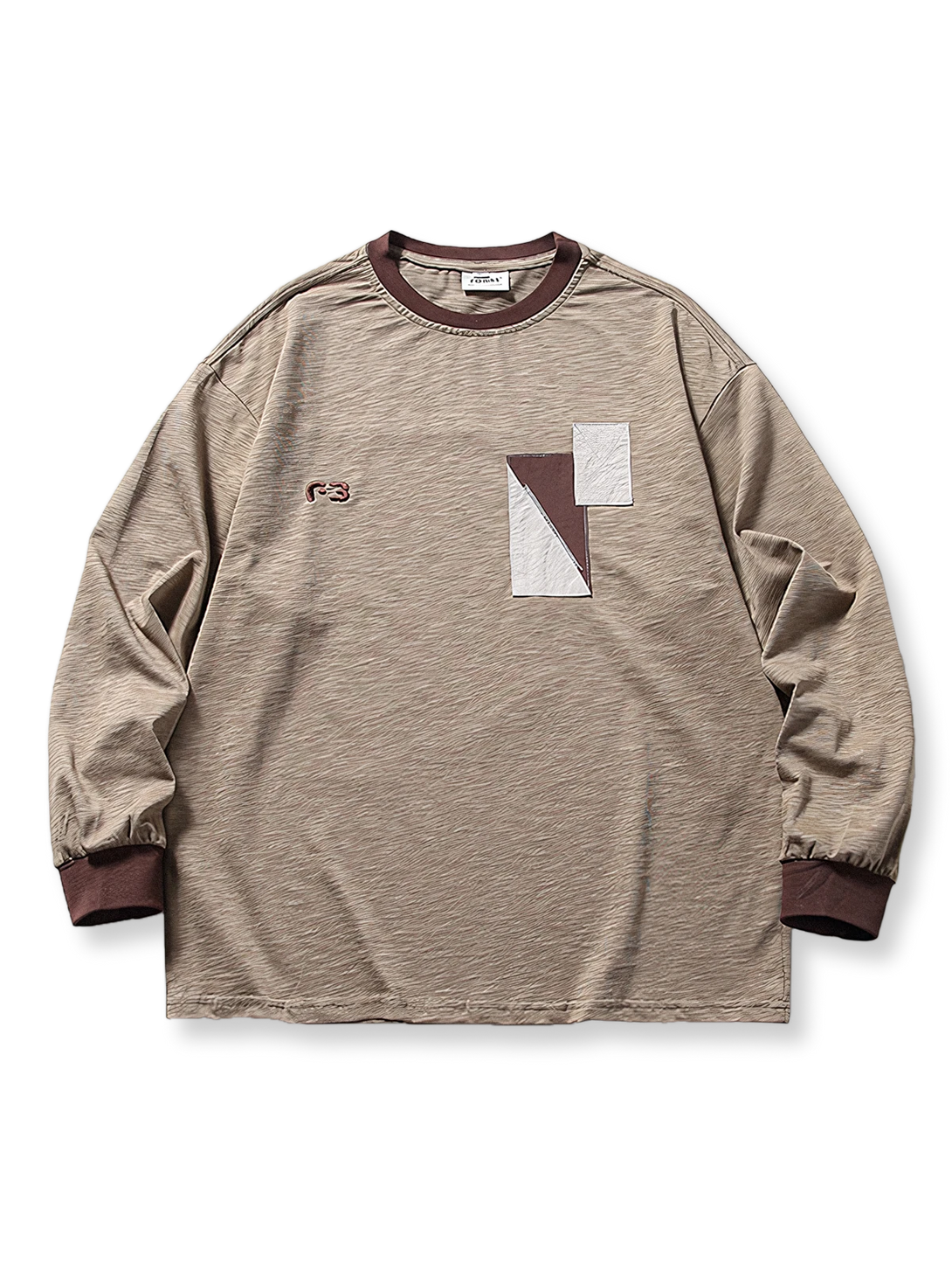 切り替えパッチワークと刺繍が特徴の2色展開長袖Tシャツ。