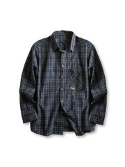 ウォッシュ加工の格子柄コットン生地と刺繍、ブロンズボタンが特徴のヴィンテージチェックシャツ。