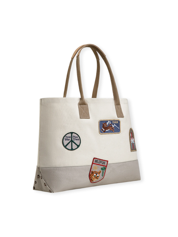 4種類のヴィンテージ刺繍章が施されたアメリカンワークウェア風トートバッグ。トップグレインレザーハンドルと堅牢なキャンバス生地が