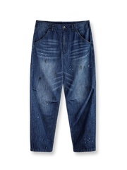 vウォッシュド加工と泥プリントが特徴のヴィンテージスタイルデニムパンツ