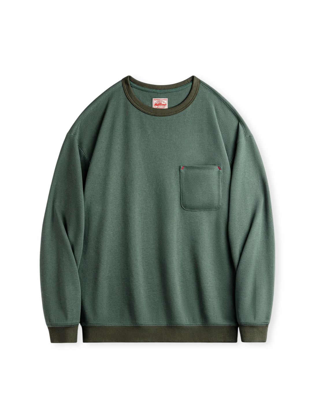 苔藻グリーンアクセントの3Dワッフルチェック生地ロングTシャツ。高めの胸ポケットとエラスティックリブ袖口・裾が特徴