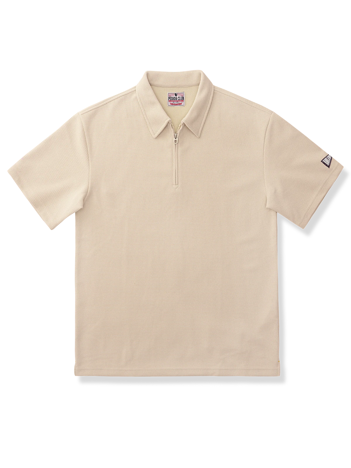 ワッフル生地のハーフジップポロシャツ。